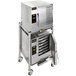 A large stainless steel AccuTemp Double-Stacked Electric Boilerless Steamer on wheels.