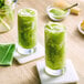 A bowl of Jade Leaf Sweetened Matcha Latte Mix powder on a counter.