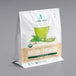 A white bag of Jade Leaf Organic Matcha Green Tea with a picture of a cup of green tea on it.