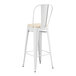 A white Lancaster Table & Seating outdoor cafe barstool with a tan cushion.