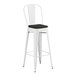 A Lancaster Table & Seating white metal outdoor barstool with black cushion.