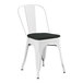 A white Lancaster Table & Seating outdoor cafe chair with a black cushion.