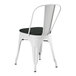 A Lancaster Table & Seating white metal outdoor cafe chair with black fabric cushion.