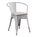 A Lancaster Table & Seating gray metal outdoor arm chair with a gray cushion.