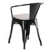 A Lancaster Table & Seating black outdoor arm chair with a gray cushion.