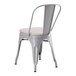 A Lancaster Table & Seating gray metal outdoor cafe chair with a gray fabric cushion.