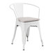 A Lancaster Table & Seating white metal outdoor arm chair with a gray cushion.