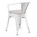 A Lancaster Table & Seating white outdoor arm chair with a cushion on top.