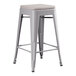 A Lancaster Table & Seating gray metal outdoor backless counter height stool with a gray cushion.