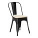 A black metal Lancaster Table & Seating outdoor cafe chair with a tan cushion.
