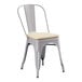 A Lancaster Table & Seating gray metal outdoor cafe chair with a tan cushion.