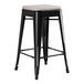 A Lancaster Table & Seating black outdoor backless counter height stool with gray fabric cushion.