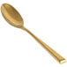 The front of a Front of the House Parker stainless steel dinner/dessert spoon with a matte brass finish.