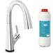 A Zurn Elkay chrome deck-mount kitchen faucet with a white filter container.