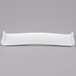 An American Metalcraft white rectangular porcelain serving platter with a curved edge.