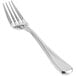 A close-up of the front of a Front of the House stainless steel dinner fork with a silver handle.