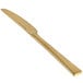 A close up of a Front of the House Parker stainless steel dinner knife with a matte brass finish.