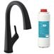 A Zurn Elkay Avado matte black deck-mount kitchen faucet with a curved handle and a white bottle.