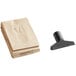 The Clarke CarpetMaster 215 vacuum cleaner with a brown bag and black plastic tool.