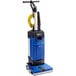 A blue and black Clarke MA10 12E walk behind cylindrical floor scrubber.