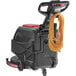 A Viper walk behind floor scrubber machine with a yellow cord.