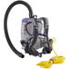 A ProTeam backpack vacuum with a hose and strap attached.