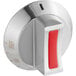 A close-up of a red and white Cooking Performance Group oven knob.