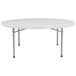 A gray NPS round folding table with metal legs.