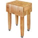 A John Boos maple wood butcher block table with casters.