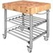A John Boos & Co. maple wood kitchen cart with metal undershelves and towel bar.