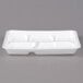 A white styrofoam school tray with five compartments.