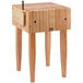 A John Boos maple butcher block table with a knife holder.