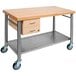 A John Boos maple kitchen cart with metal undershelf and towel bars.