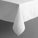 A white rectangular tablecloth with a hemmed edge on a table.