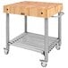 A John Boos maple kitchen cart with a wooden cutting board on a metal cart.