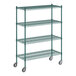 A green metal Regency wire shelving unit with wheels.