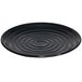 A black GET Milano melamine plate with ripples on it.