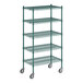 A green metal wire shelving unit with wheels.