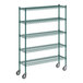 A Regency green metal wire shelving unit with wheels.