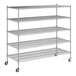 A Regency chrome wire shelving unit with wheels and four shelves.