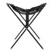 A black folding high chair with a black mesh seat.