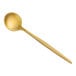 An Acopa Odin gold stainless steel demitasse spoon with a long handle.