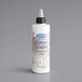 A white bottle of Satin Ice Silver Vanilla Glitter Glaze with a black cap.