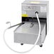 A Frymaster fryer oil filtration machine with a hose coming out of it.
