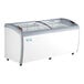 An Avantco curved glass top display freezer on wheels.