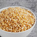 A bowl of Amish Country white baby butterfly popcorn kernels.