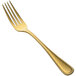 A close-up of the handle of a Bon Chef Positano gold European dinner fork.
