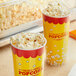 Two cups of Amish Country Yellow Baby Butterfly Popcorn on a counter.