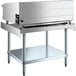 A stainless steel Cooking Performance Group lava briquette charbroiler on a Regency Equipment stand.