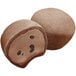 A close-up of two My/Mochi Double Chocolate Mochi Ice Cream balls with eyes and a face.